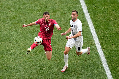 Milos Veljkovic vies for the ball with Andraz Sporar